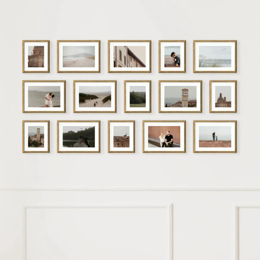 Symmetrical grid of same-sized frames in perfect alignment above contemporary furniture