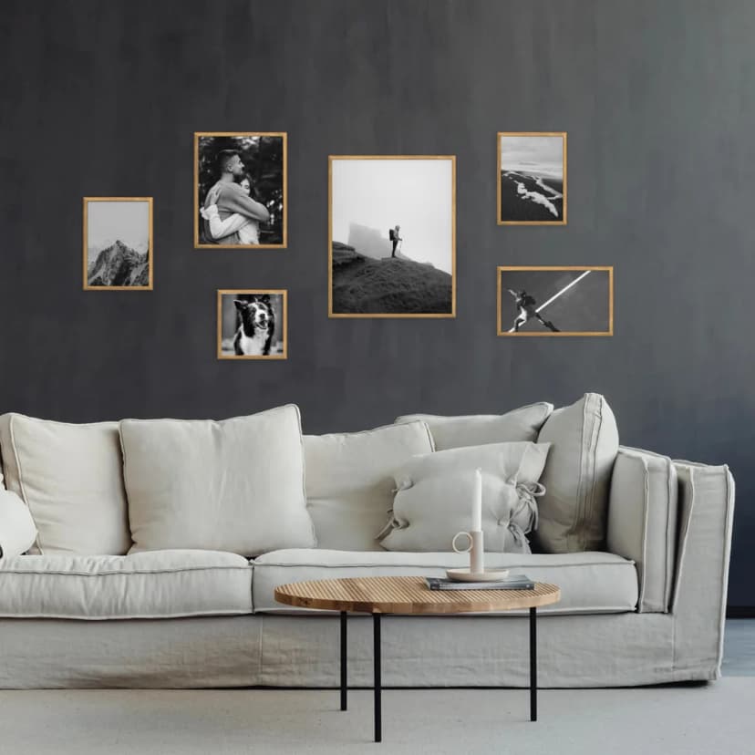 Gallery wall with frames arranged in ascending size order creating a stepping-stone effect