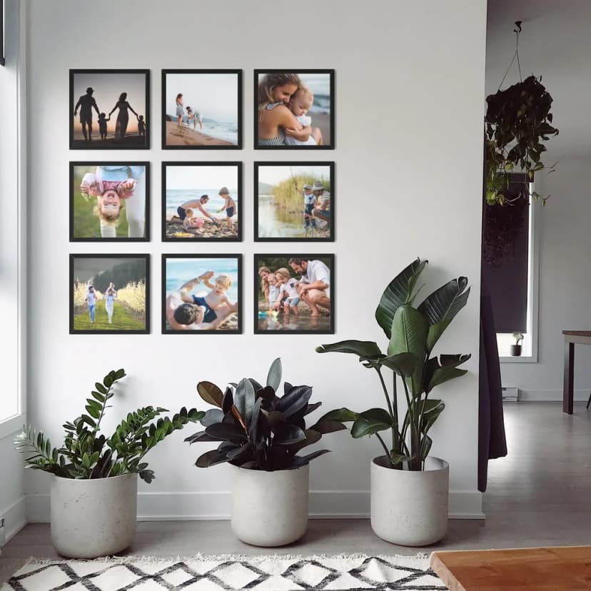 Beautiful [photo wall](/en-gb/photo-gallery-walls) display in modern living room