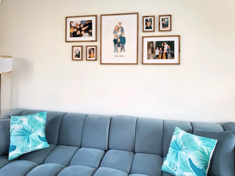 Family [gallery wall](/en-gb/photo-gallery-walls) with MDF frames above a couch